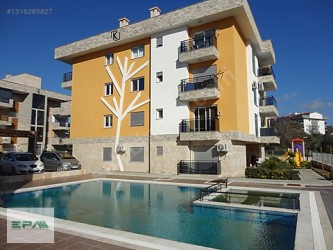 Kuşadası İkiçeşmelik mah.Otogar yakın havuzlu kiralık 1+1