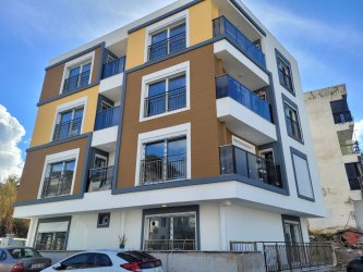 GÜRMES EMLAKTAN KUŞADASI DAVUTLARDA SATILIK 2+1 YENİ BAHÇE KATI DAİRE 