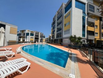 GÜRMES EMLAKTAN KUŞADASI EGE MAHALLESİNDE SATILIK 2+1 BAHÇE KATI DAİRE 